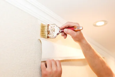 Pose de papier peint à Curnier — revêtements muraux et toiles de verre